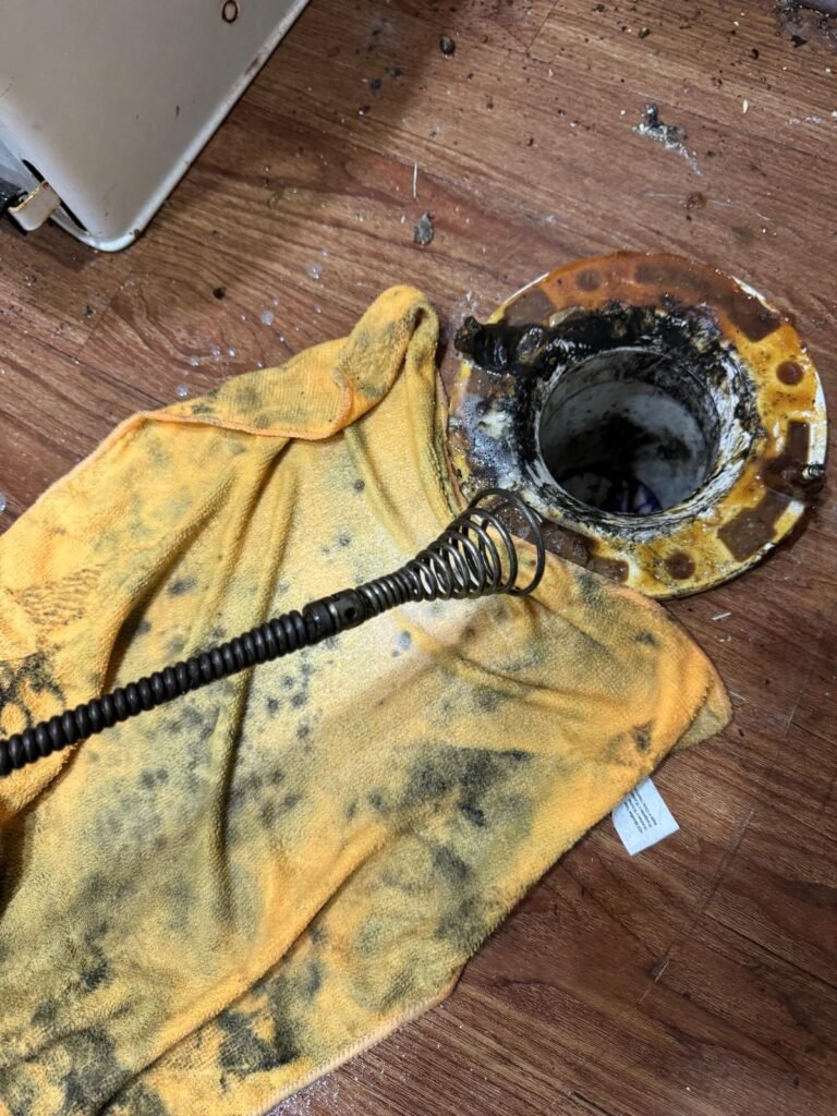 Drain Cleaning in Progress in New Port Richey, FL 34652 Drain opening with cleaning tool in New Port Richey, FL 34652