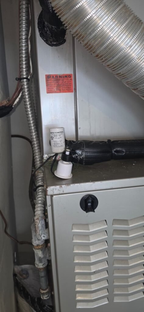 A float switch on an air handler’s drain line in Tampa, FL 33647.
