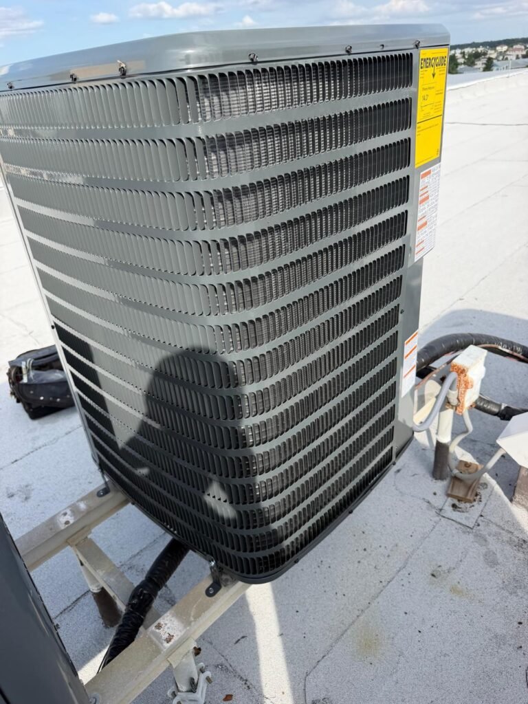 Goodman condenser unit with connections on rooftop in Indian Rocks Beach, FL 33785