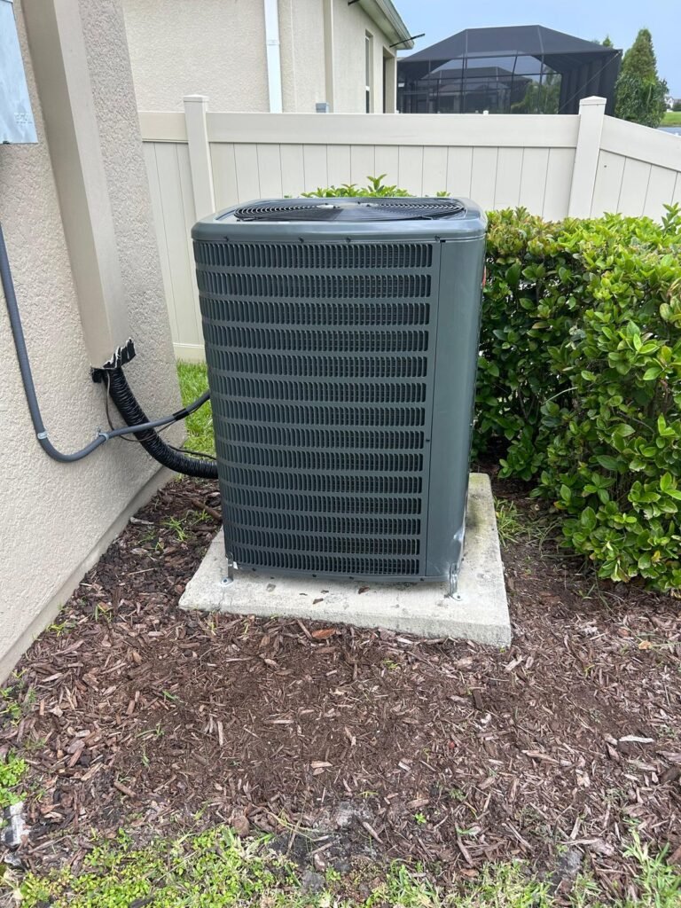 Goodman condenser unit next to house in Riverview, FL 33579