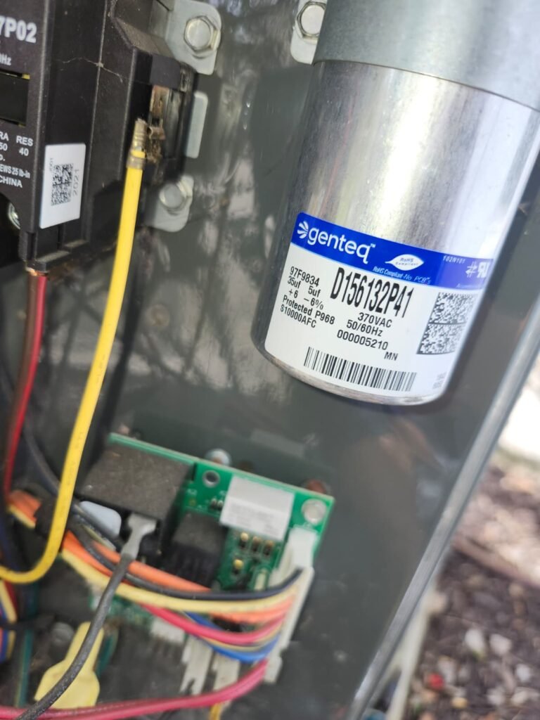 Close-up of capacitor label in HVAC unit, Tampa, FL 33610