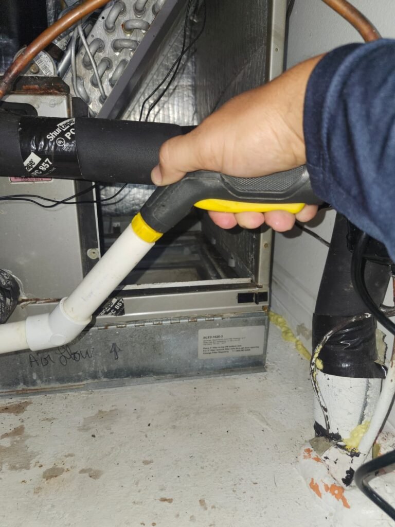 Technician working on HVAC component in Tampa, FL 33626
