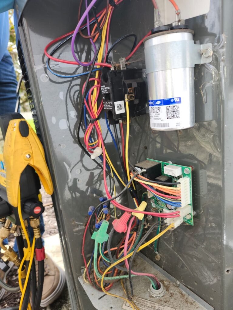 HVAC unit with wiring and tool during service in Tampa, FL 33610