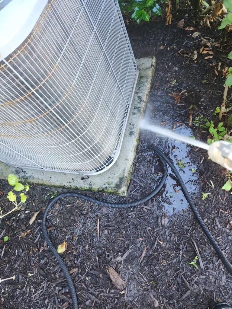 HVAC unit cleaning from another angle in Tampa, FL 33626