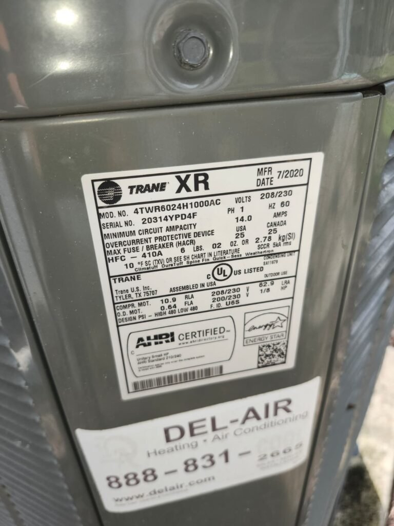 Close-up of HVAC unit label with specifications in Tampa, FL 33610