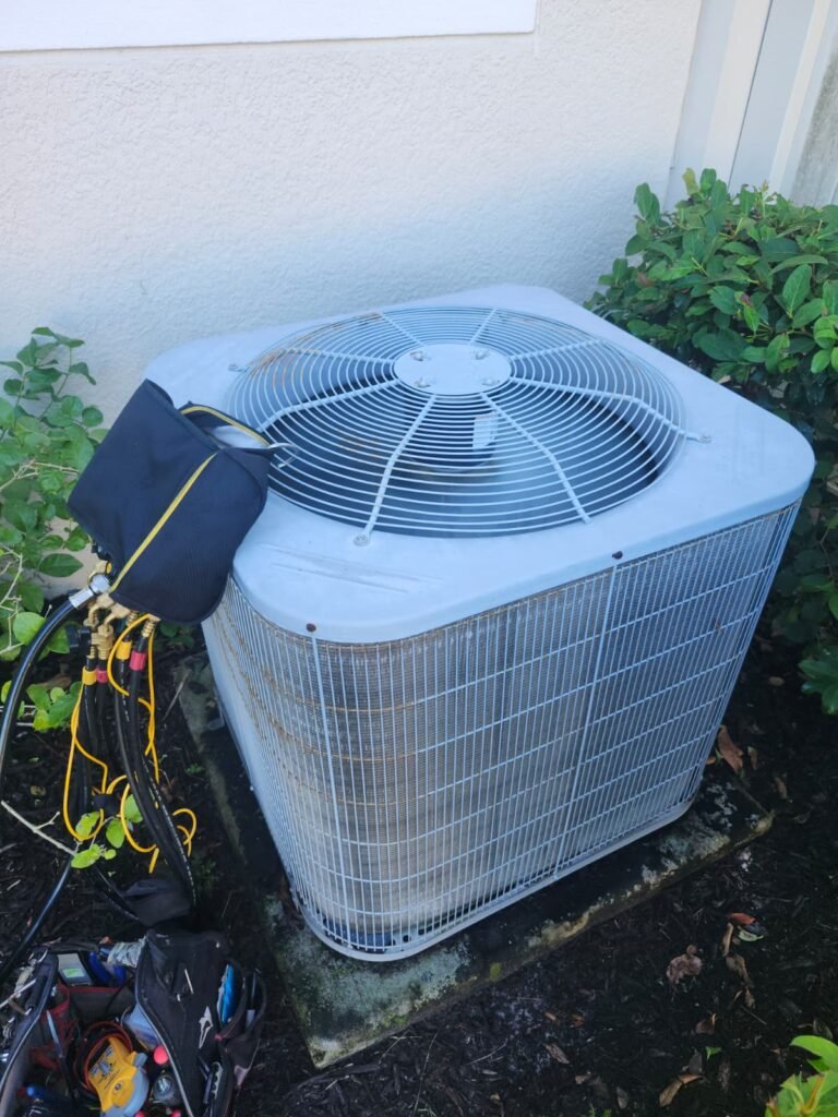 HVAC unit with tools during maintenance in Tampa, FL 33626