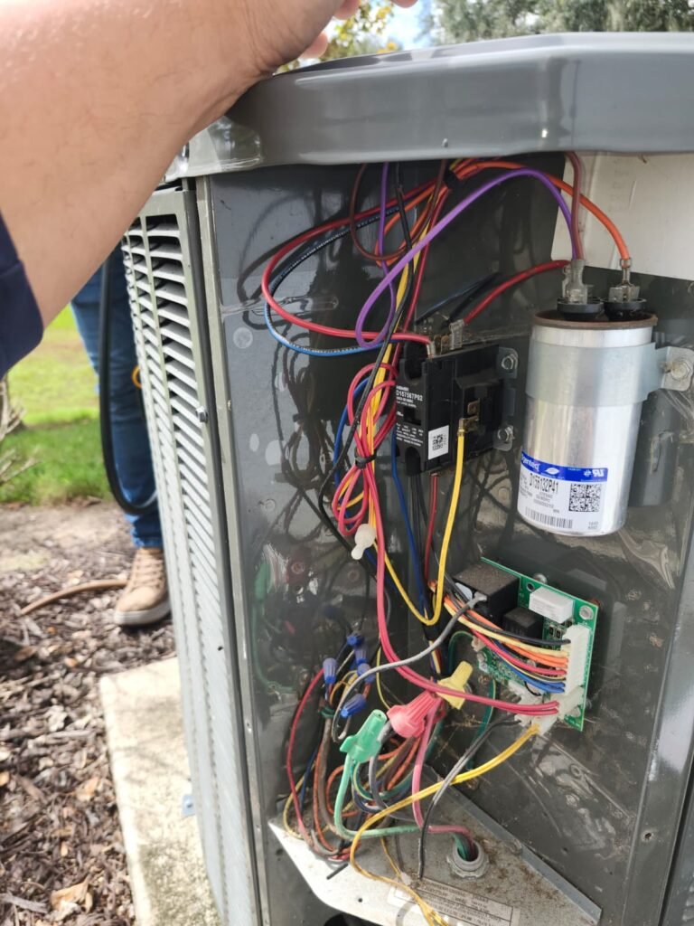 Open HVAC unit with wiring during service in Tampa, FL 33610