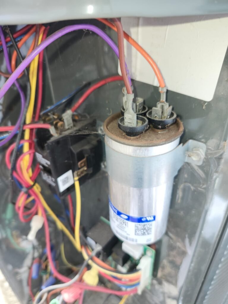 Close-up of wiring and capacitor in HVAC unit, Tampa, FL 33610