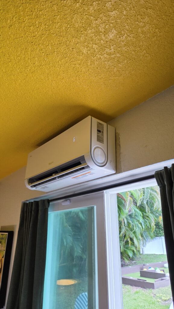 A mini-split indoor head installed above a window in Largo, FL 33774.