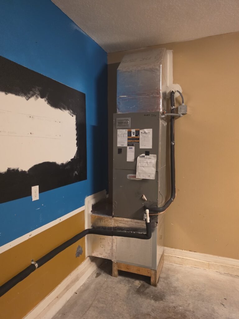 Installed air handler with duct connections in Ruskin, FL 33570.