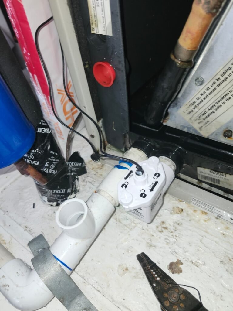 A float switch installed on an air handler’s drain line in Tampa, FL 33610.