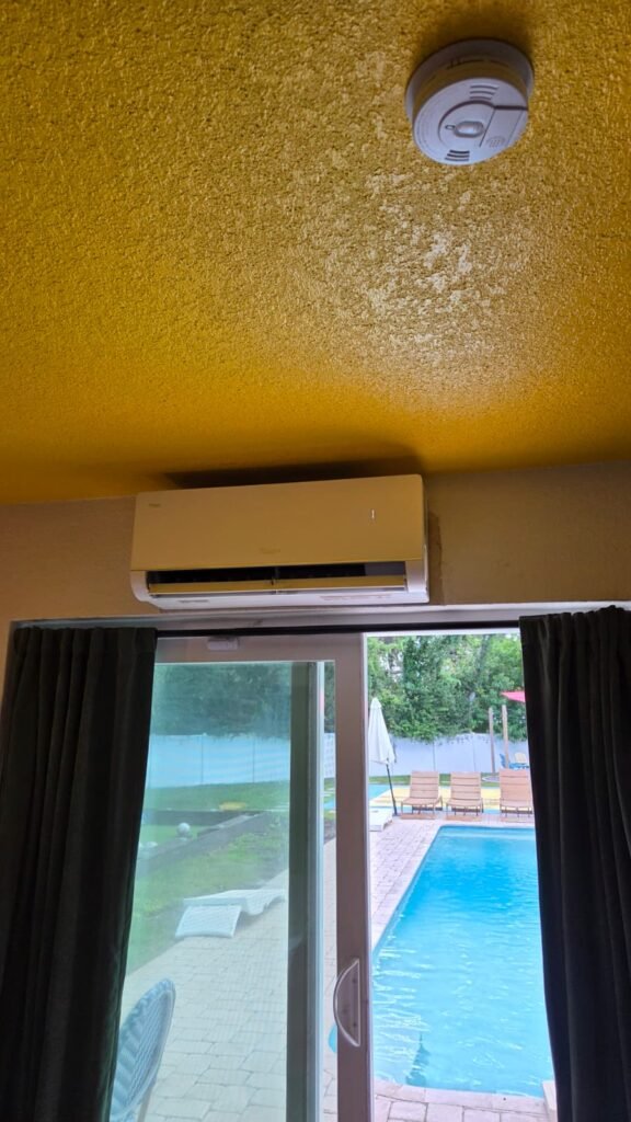 A ductless indoor unit mounted above a sliding door in Largo, FL 33774.