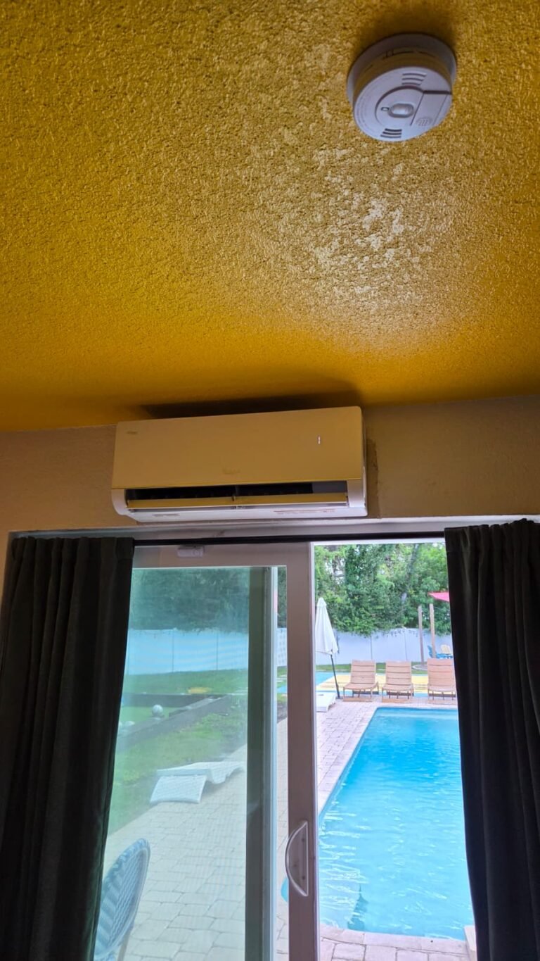 Mini-Split Above Sliding Door in Largo, FL 33774 Mini-split unit above sliding door with pool view in Largo, FL 33774