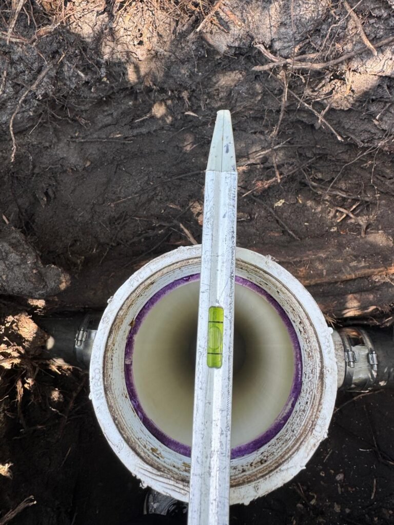 Open clean-out pipe with a level tool in Clearwater, FL 33764