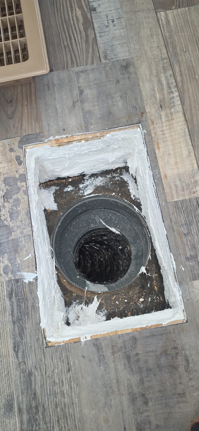 Open floor vent showing ductwork in Palm Harbor, FL 34684