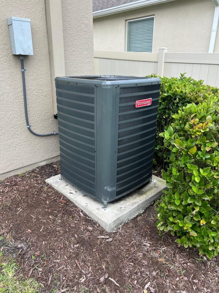 A Goodman condenser on its pad in Riverview, FL 33579.