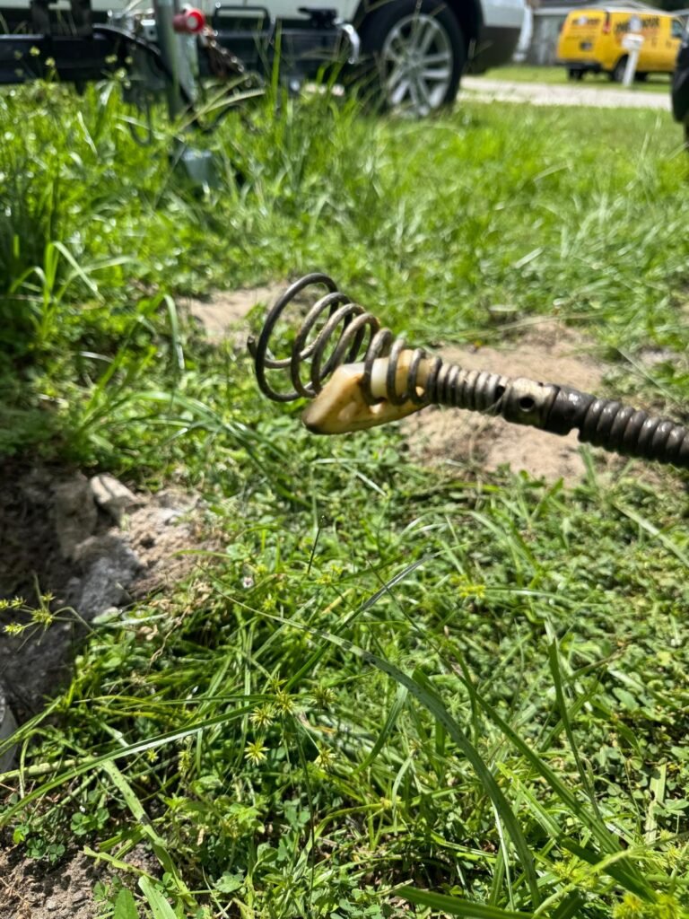 A drain cable head pulled from the line with debris after a clog was cleared in Tampa, FL 33615.