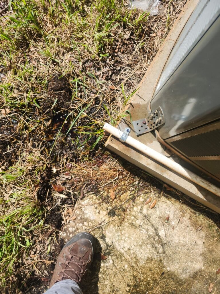 Close-up of PVC drain line near HVAC unit in Tarpon Springs, FL 34689