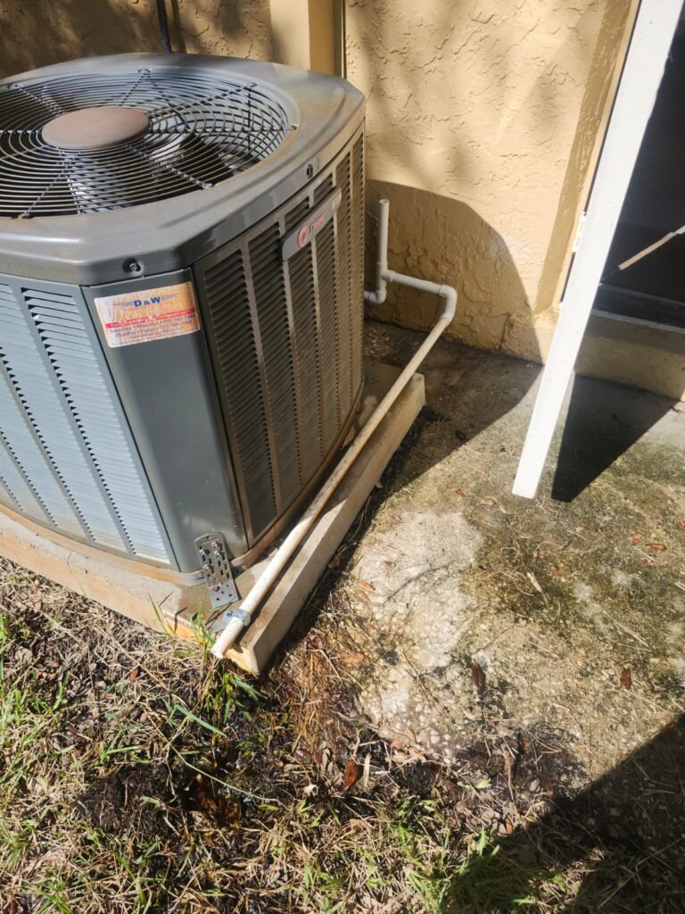 HVAC unit with PVC drain line in Tarpon Springs, FL 34689