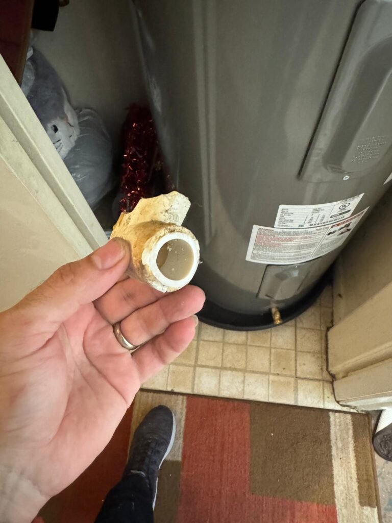 Removed pipe fitting near water heater, Tampa, FL 33612