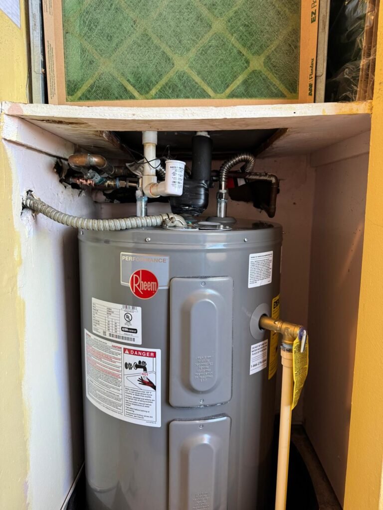 A Rheem tank water heater installed in a closet in Redington Shores, FL 33708.