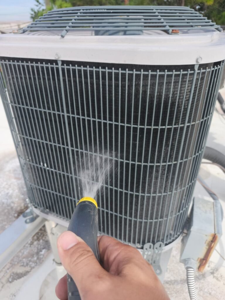 Rinsing a rooftop condenser coil in Tampa, FL 33610
