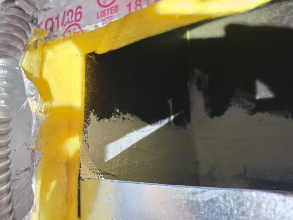 A duct opening sealed with mastic next to the insulation in Tampa, FL 33609.