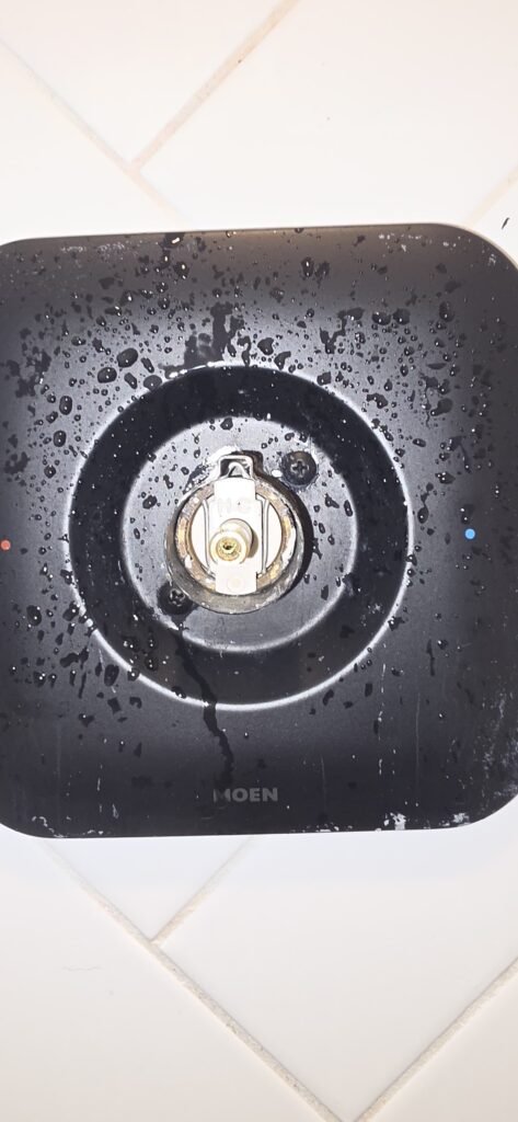 A single-handle shower valve with the handle off and the cartridge stem showing in Zephyrhills, FL 33541.