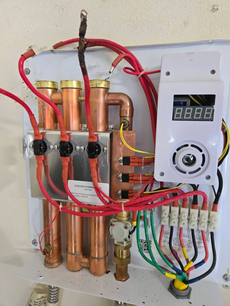 Exposed tankless water heater with wiring in Riverview, FL 33579