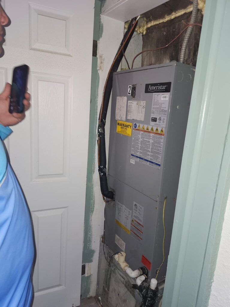 Technician with HVAC component in Tampa, FL 33603