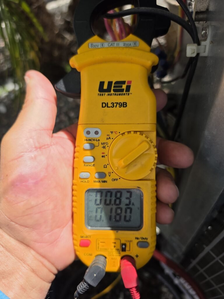 Technician Using Multimeter in Wesley Chapel, FL 33545 Technician using multimeter, Wesley Chapel, FL 33545