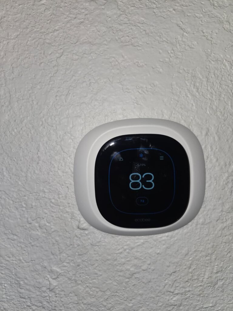 Digital thermostat on wall in Tampa, FL 33603