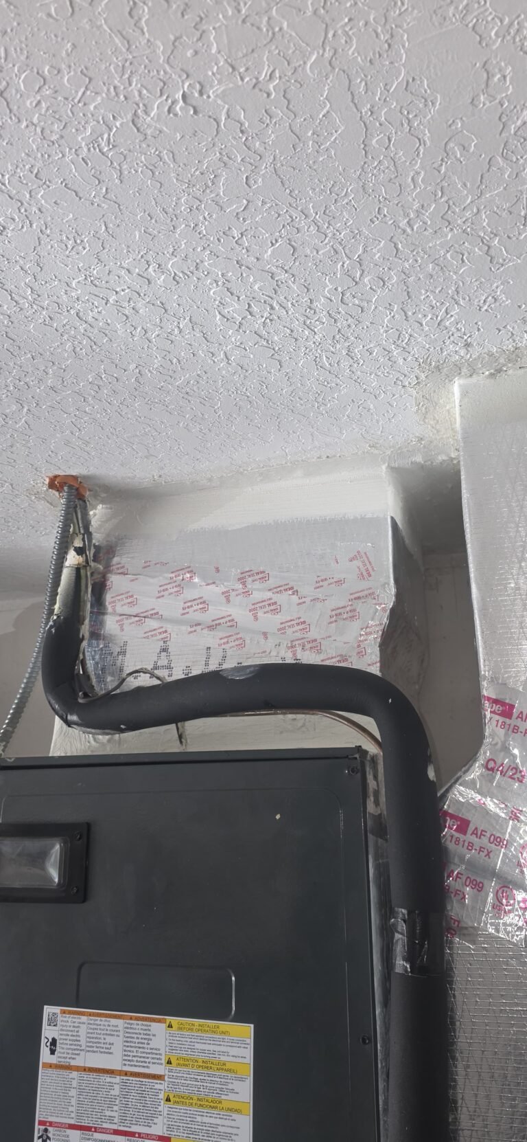 Top section of HVAC unit with ductwork, Tampa, FL 33626