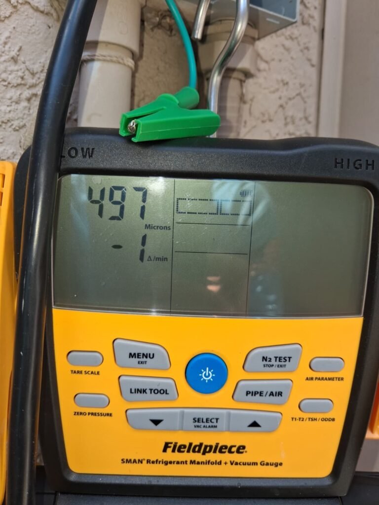 Digital vacuum gauge used in copper line insulation replacement, Tampa, FL 33635