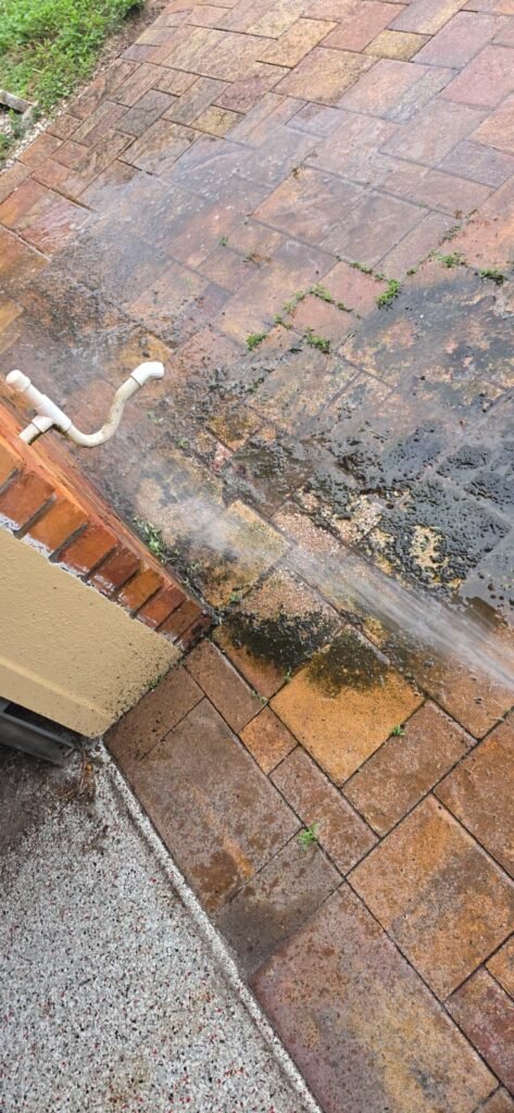 Water discharging from drain pipe onto patio in St. Petersburg, FL 33703