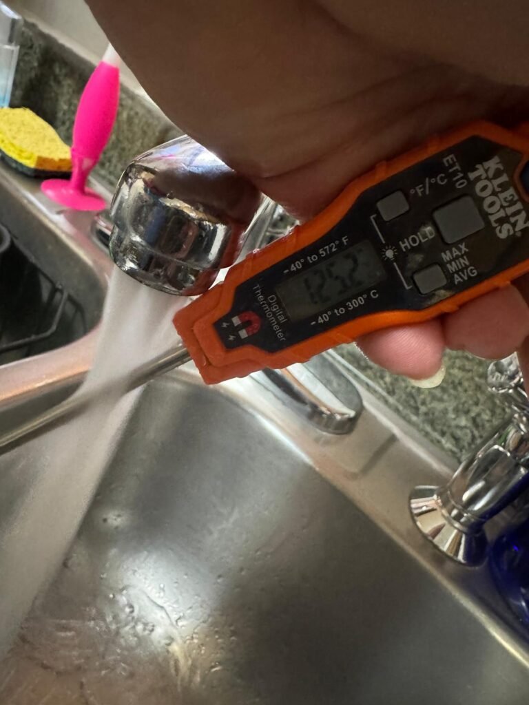 Digital thermometer measuring water temperature, Tampa, FL 33612
