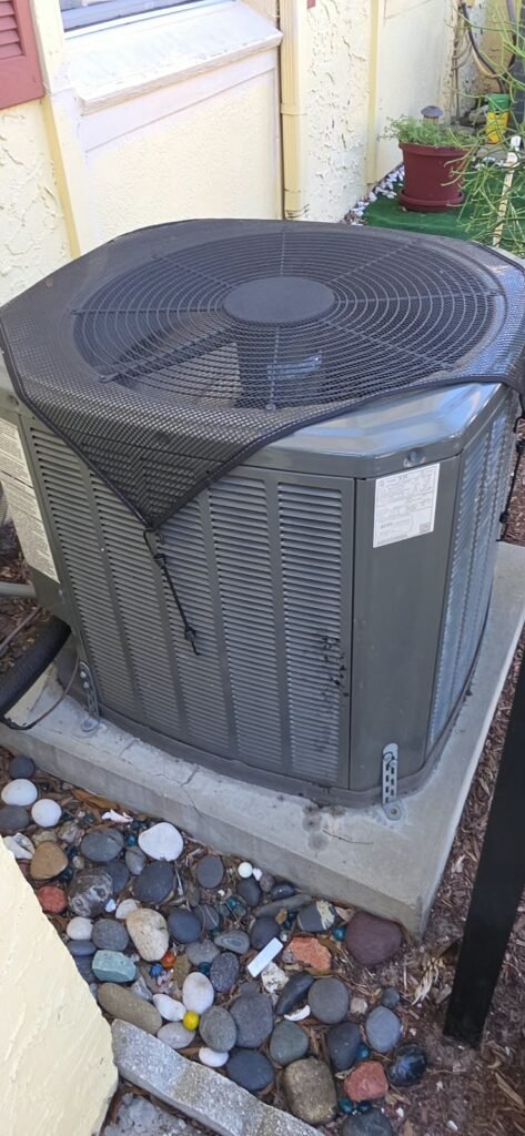 Outdoor AC unit with cover after tune-up in Tampa, FL 33615