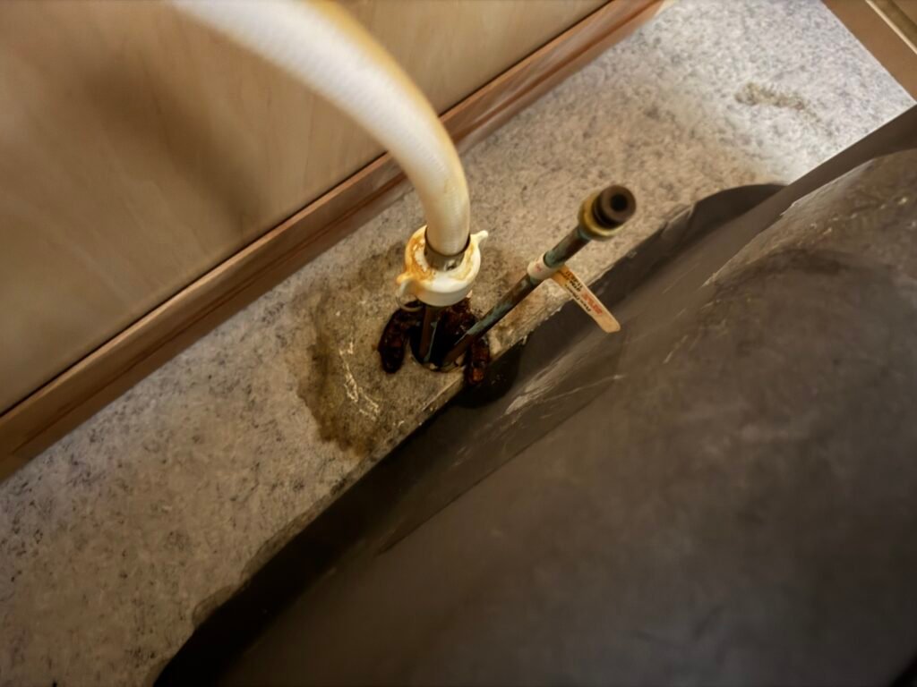 A corroded angle stop valve under a sink before replacement in Lutz, FL 33559.