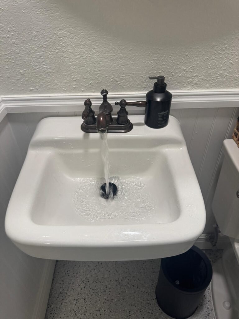 Bathroom sink with running water in St. Petersburg, FL 33707