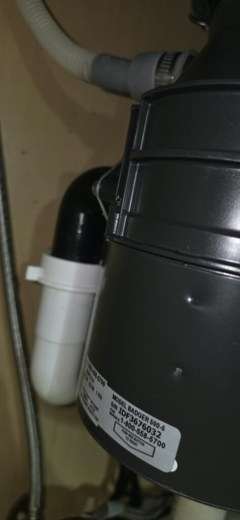 Close-up of garbage disposal with plumbing in Lithia, FL 33547
