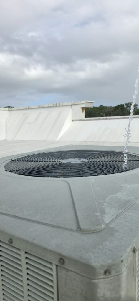 Close-up of Water Spray on Top of HVAC Unit in Wesley Chapel, FL 33543 Close-up of water spray on top of HVAC unit in Wesley Chapel, FL 33543