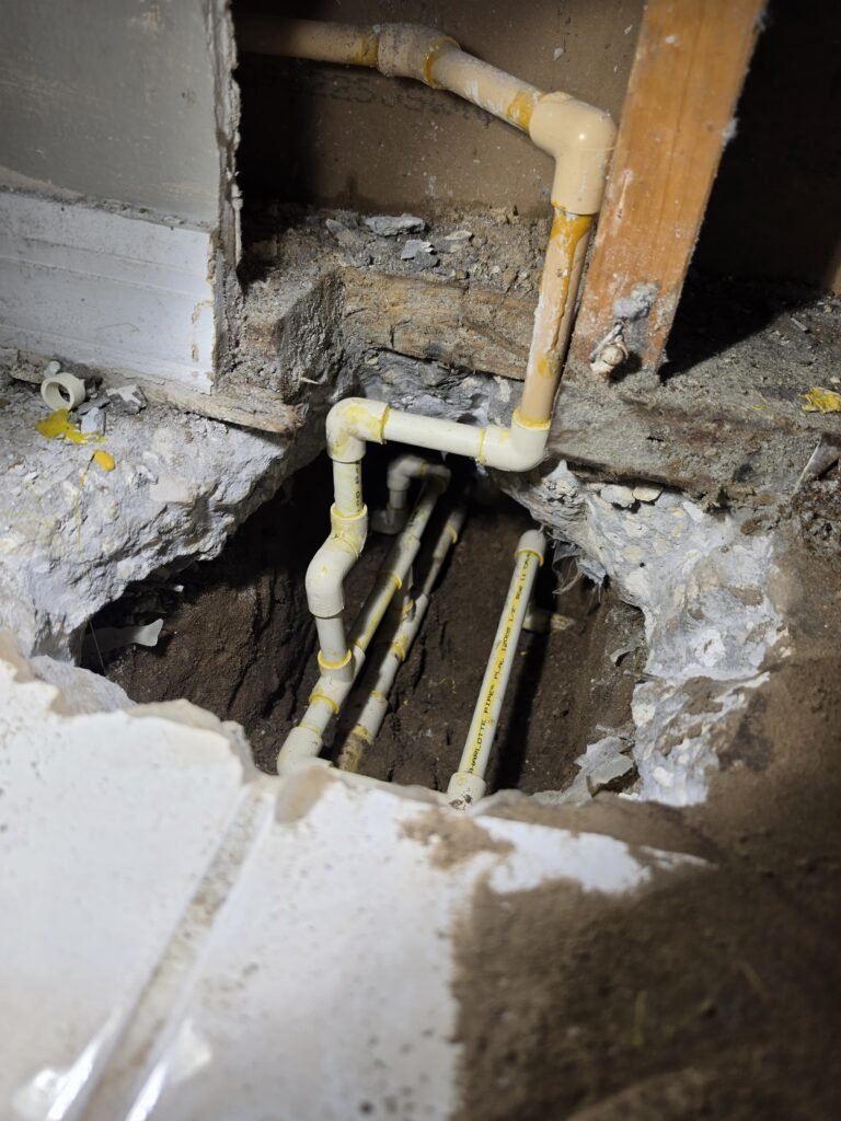 Concrete Floor Hole with CPVC Pipes, Brandon, FL 33511 Hole in concrete floor with CPVC pipes, Brandon, FL 33511
