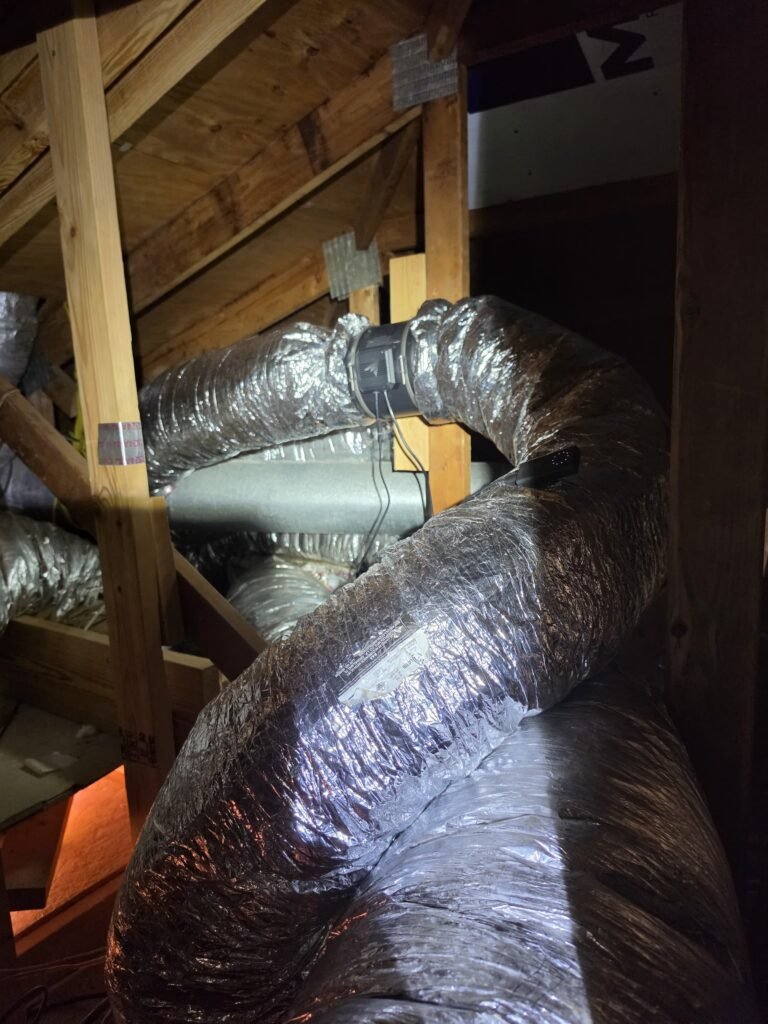 Ductwork with inline exhaust fan in attic, Tampa, FL 33618