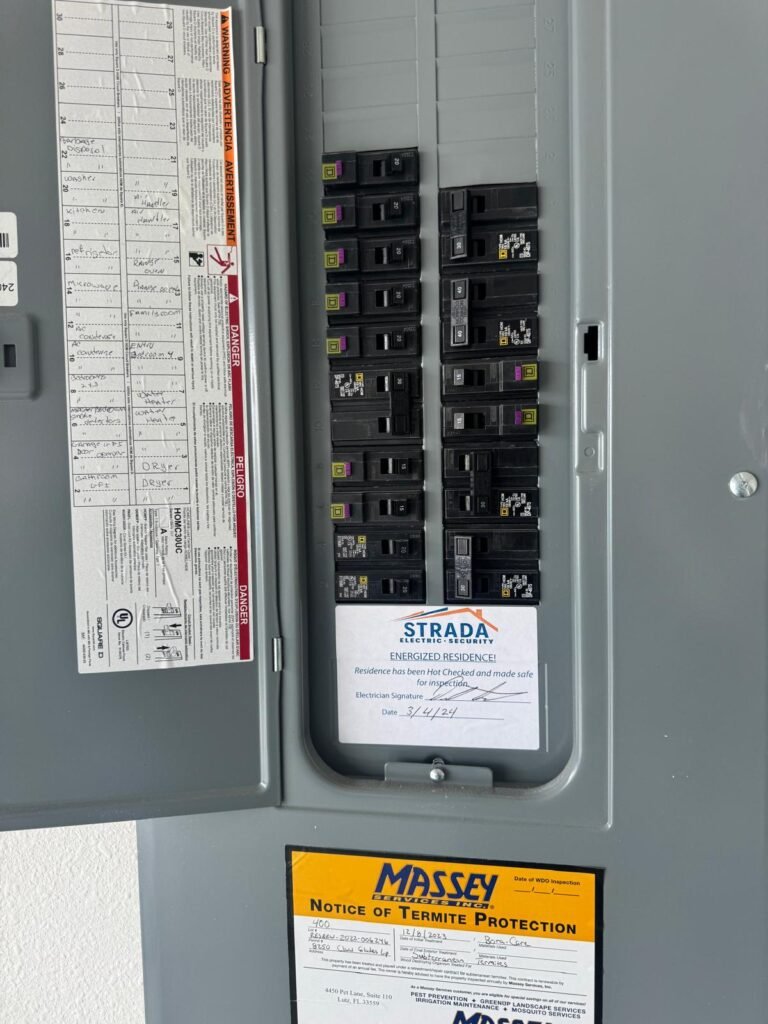 Open electrical panel with circuit breakers in Wesley Chapel, FL 33545