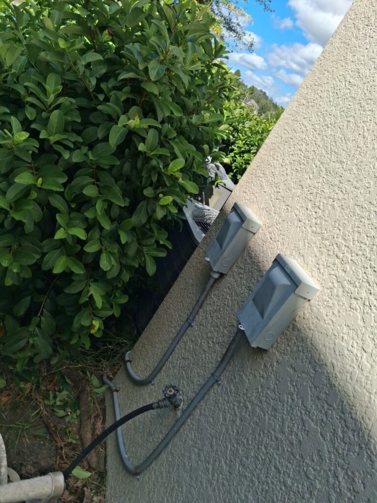 Exterior View Near HVAC Unit in Tampa, FL 33647 Exterior view with disconnect boxes near HVAC in Tampa, FL 33647