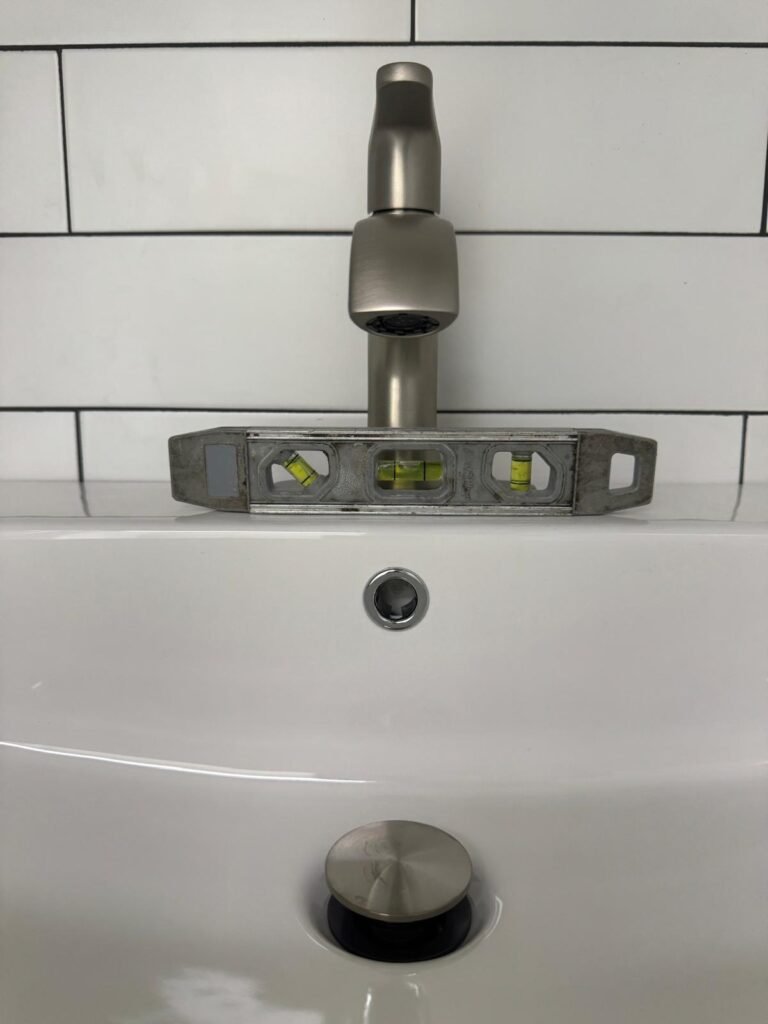 A level set on a newly installed bathroom faucet in Tampa, FL 33634.