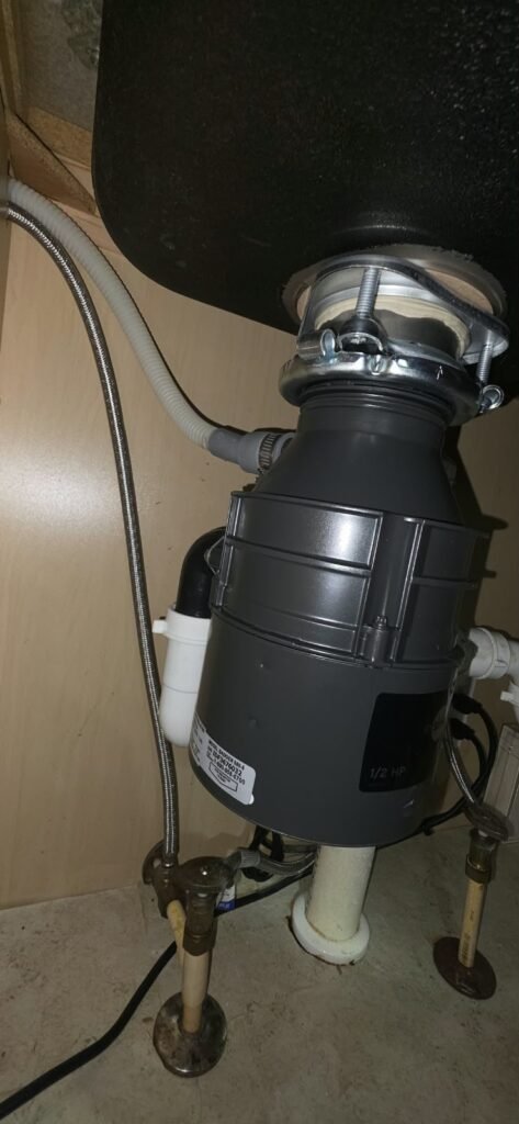 Garbage disposal and plumbing under sink in Lithia, FL 33547