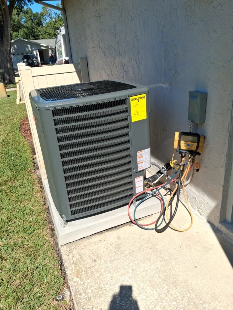 Goodman condenser unit with gauges during installation in Palm Harbor, FL 34684