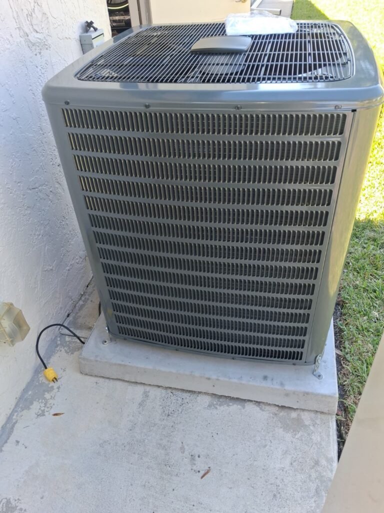 Goodman condenser unit with wall outlet in Palm Harbor, FL 34684