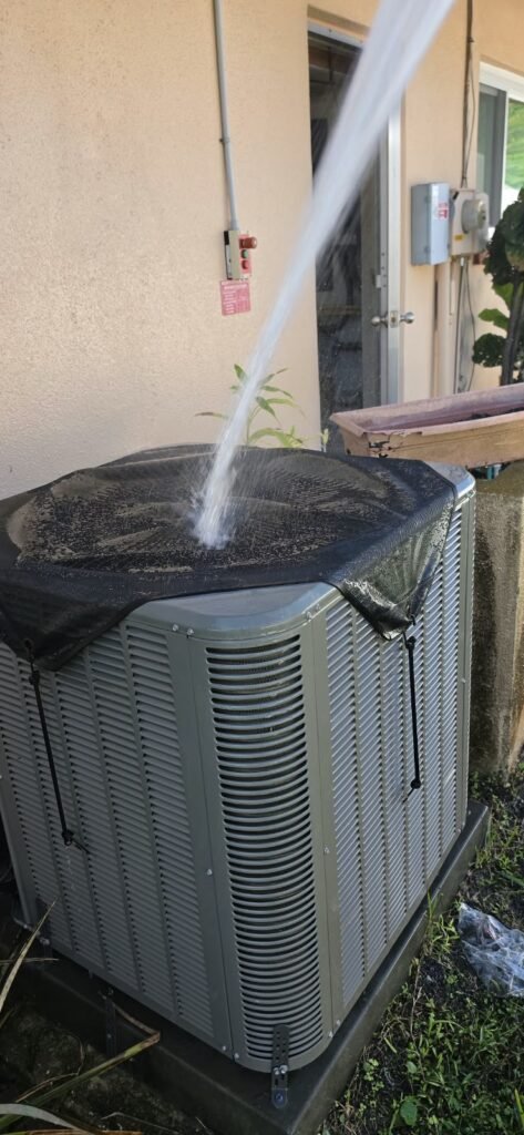 HVAC unit being cleaned with water in Clearwater, FL 33764